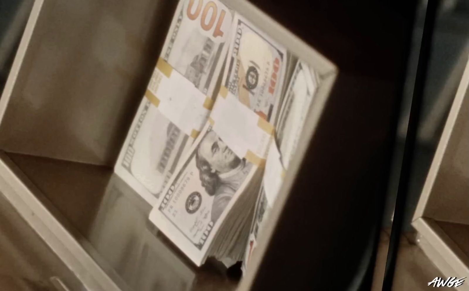 a bunch of money sitting on top of a shelf