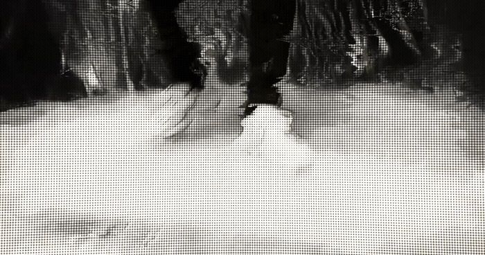 a man riding skis down a snow covered slope