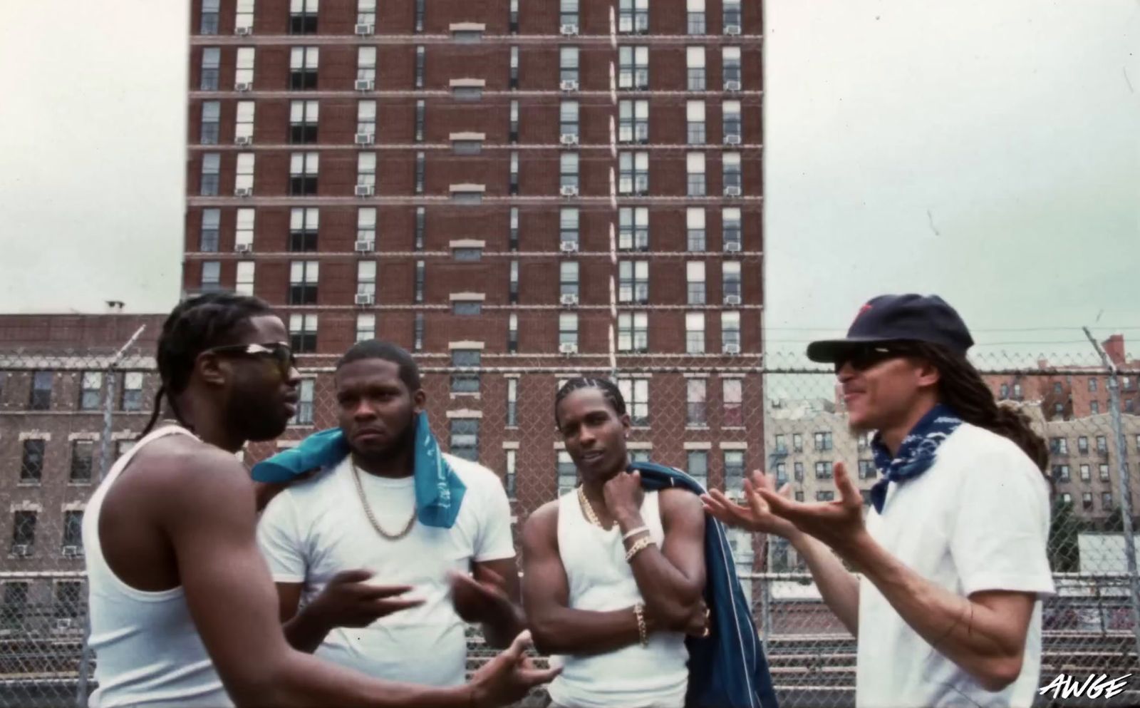 a group of men standing next to each other in front of a tall building