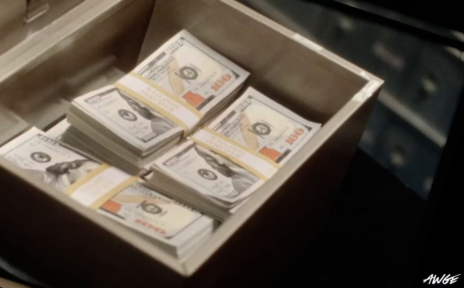 a box filled with lots of money sitting on top of a table