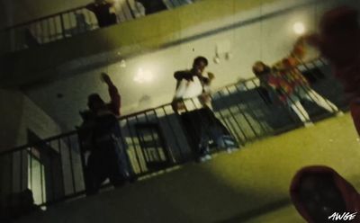 a group of people standing on top of a balcony