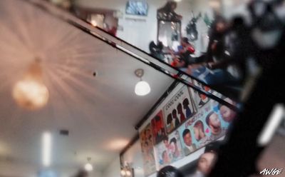 a blurry photo of a restaurant with people sitting at tables