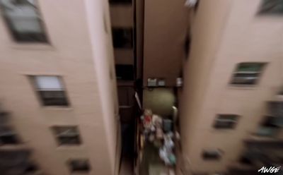 a blurry photo of a person walking down a street