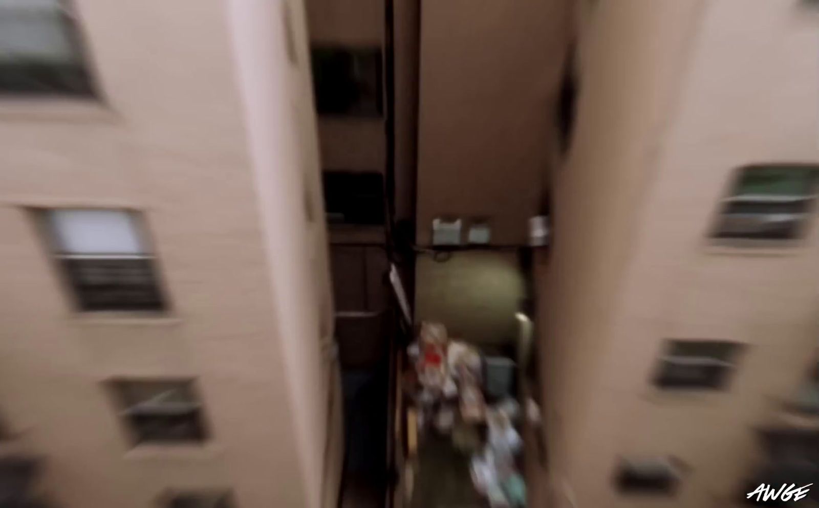 a blurry photo of a person walking down a hallway