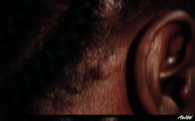 a close up of a person's ear with a black background