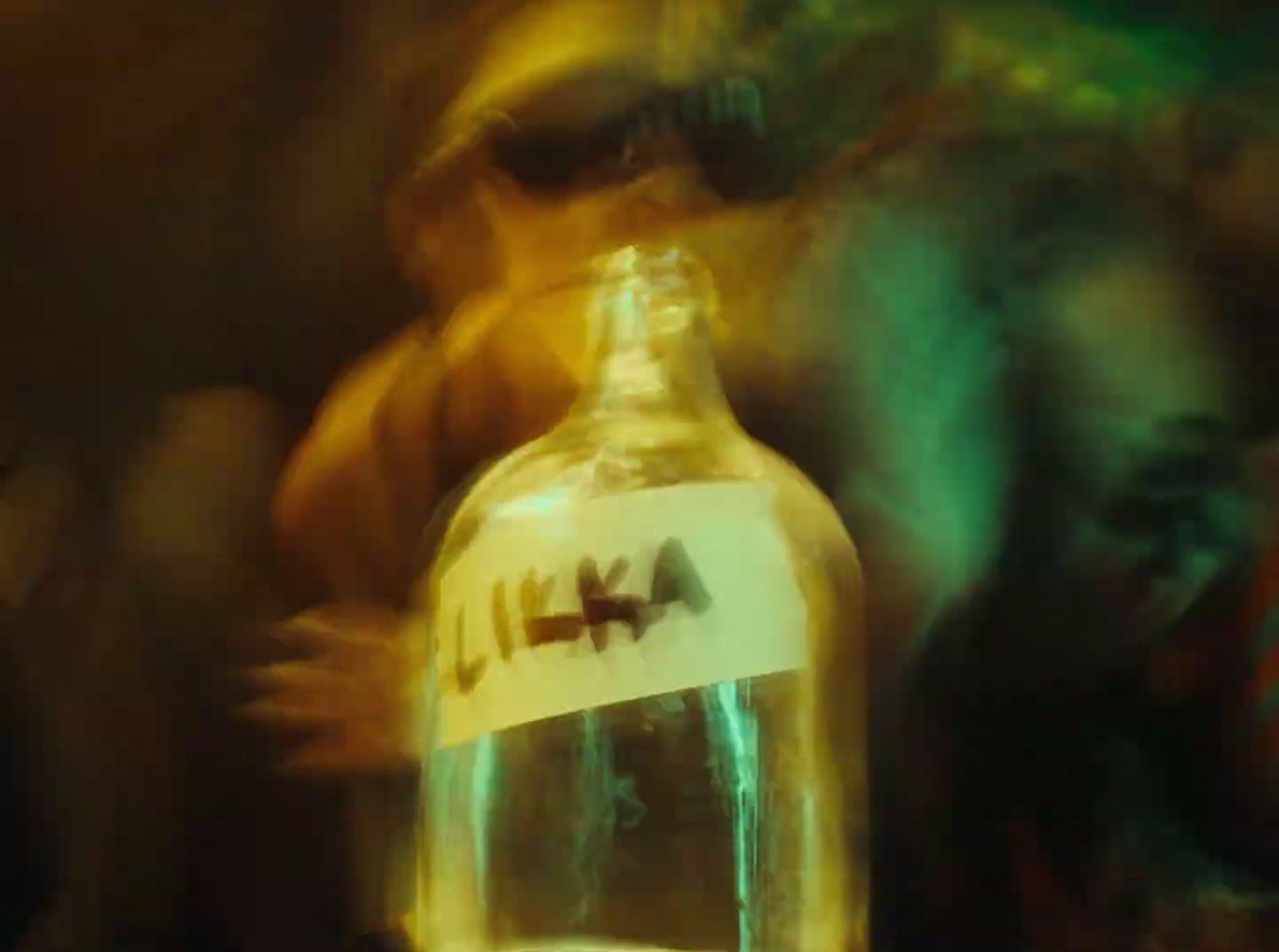 a blurry photo of a bottle of alcohol