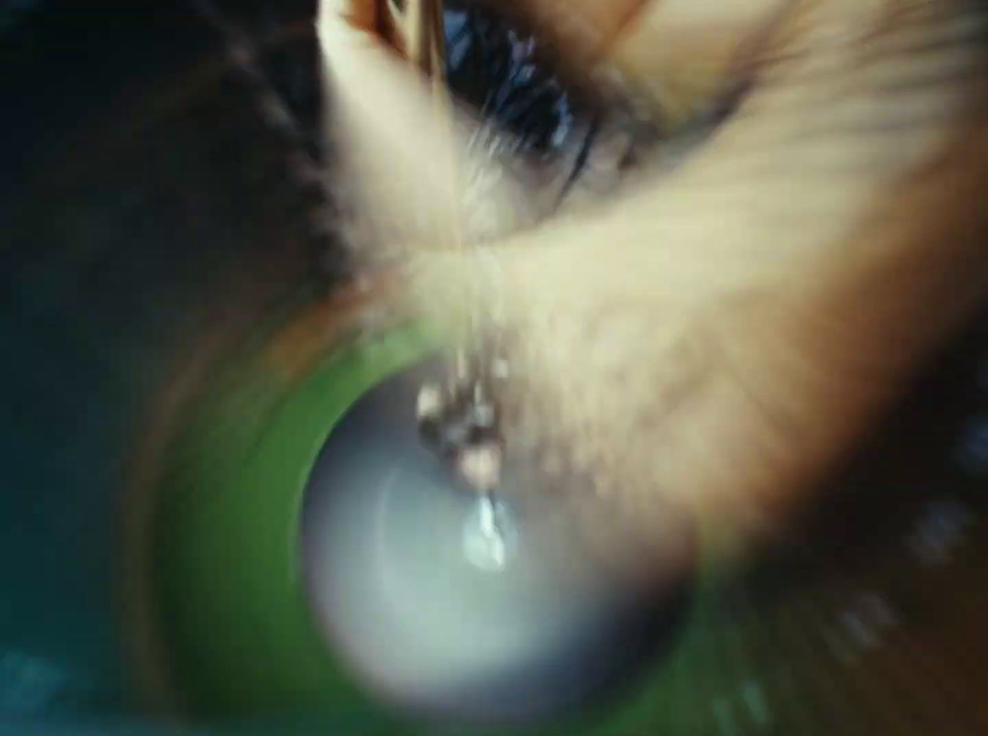 a close up of a person's eye with a blurry background