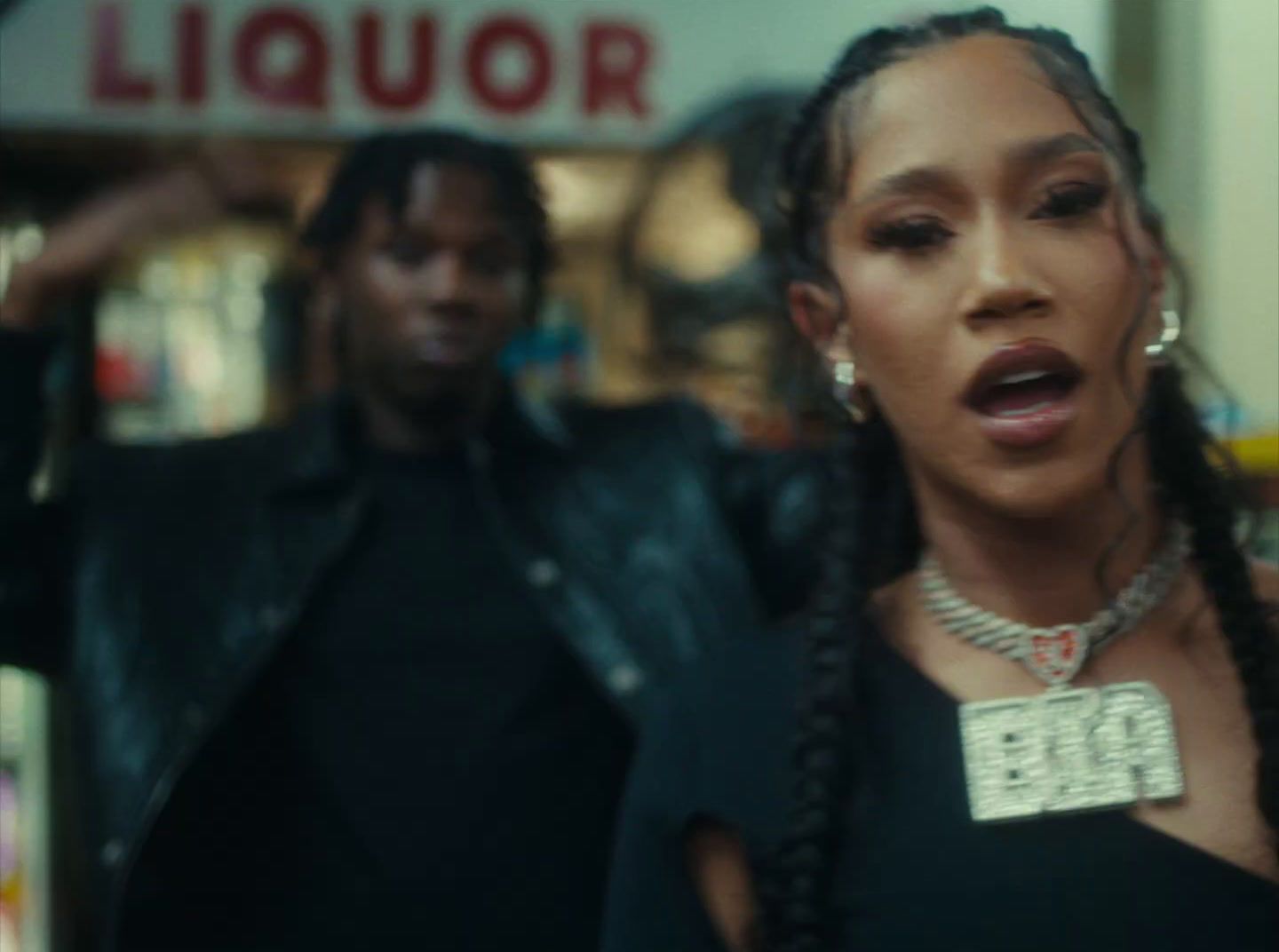 a man and a woman standing in front of a liquor store