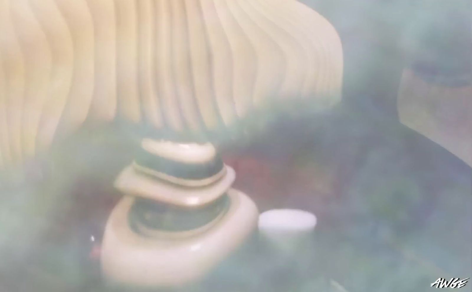 a white vase sitting on top of a wooden table