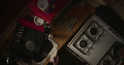 a stove top oven sitting next to a sink