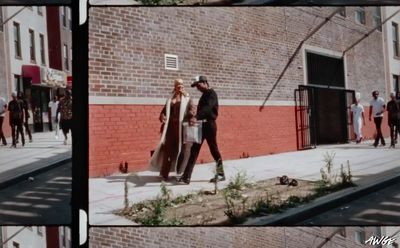 a man and a woman walking down a street