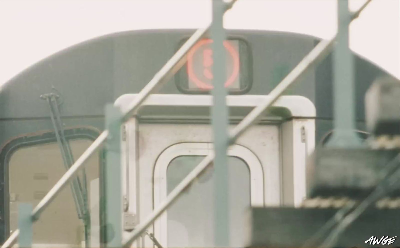 a close up of a train with a red light