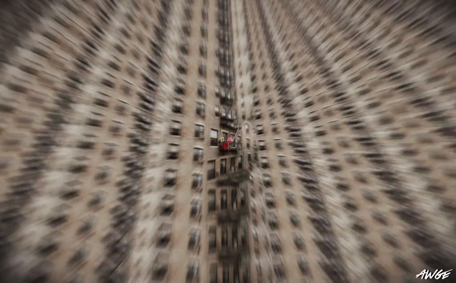 a blurry photo of a building with a red light in the middle of it