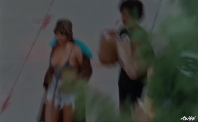 a blurry photo of two people standing next to each other