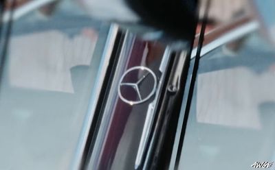 a close up of a mercedes emblem on a car