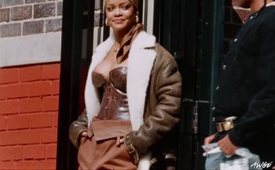 a man and a woman standing outside of a building