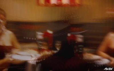 a blurry photo of two women sitting at a table