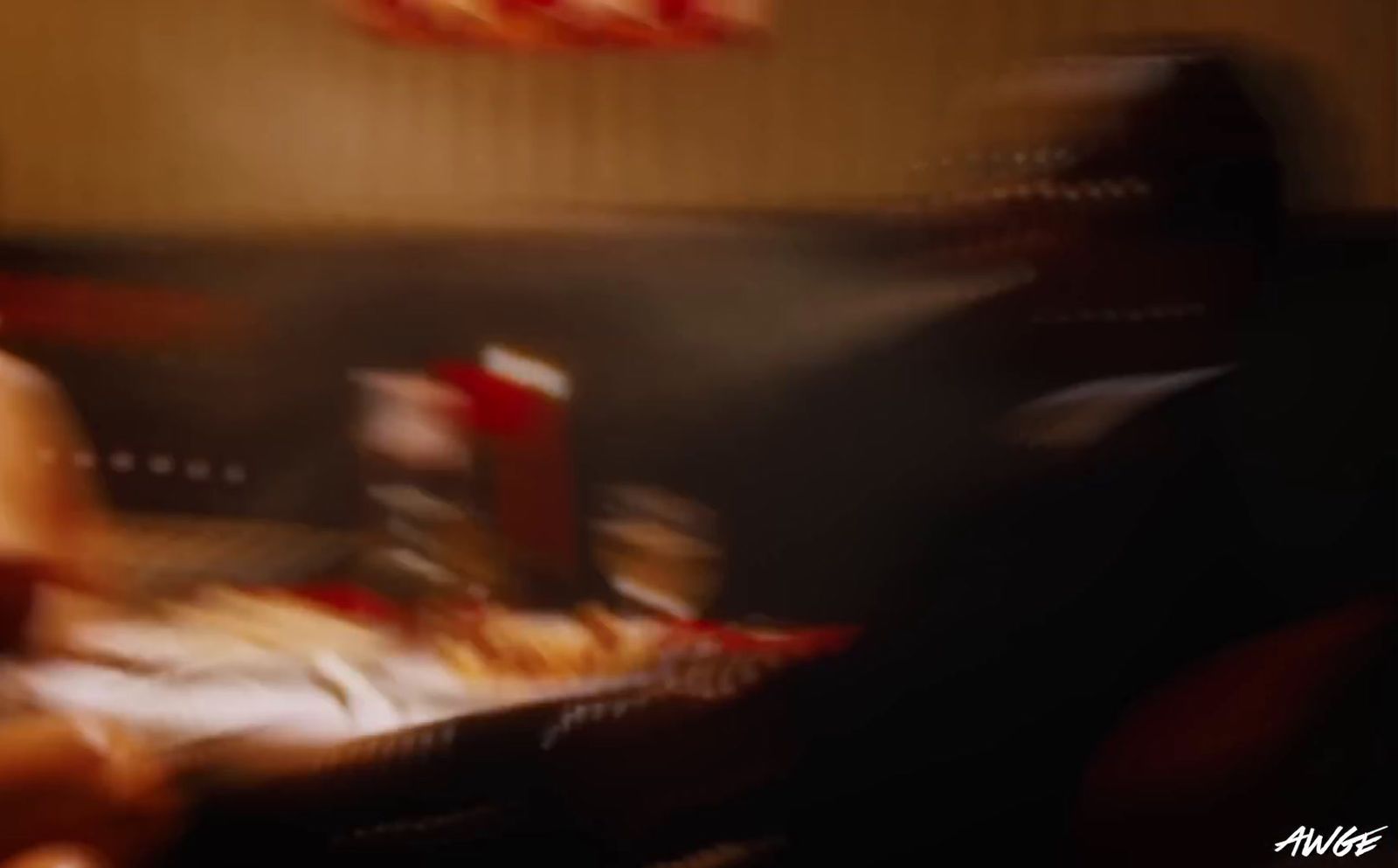 a blurry photo of a person sitting at a table