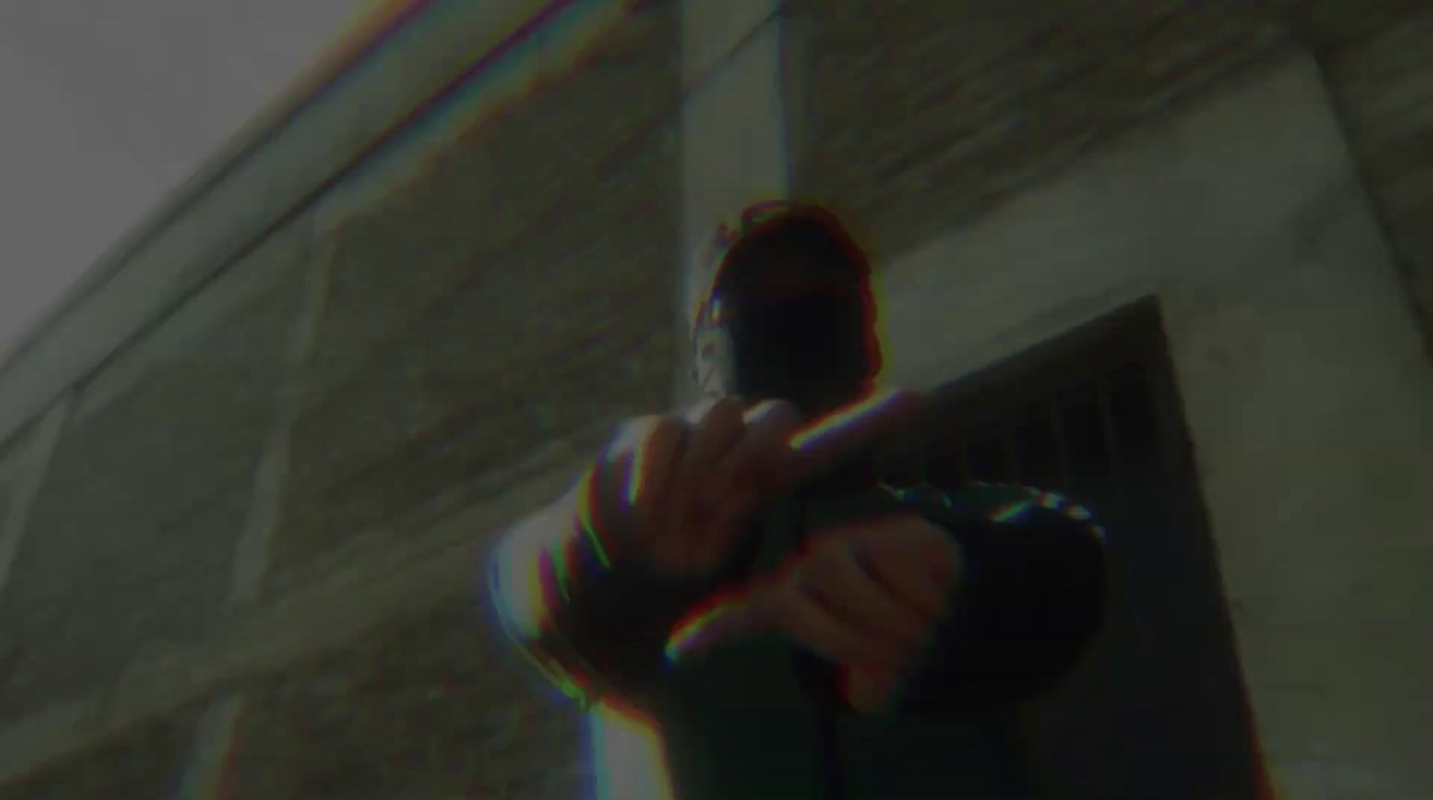 a blurry image of a man holding a gun