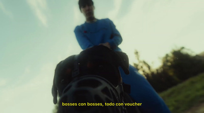 a blurry photo of a person riding a horse