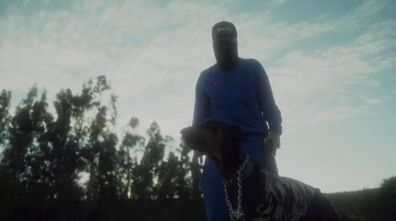 a man riding a horse with a chain around his neck