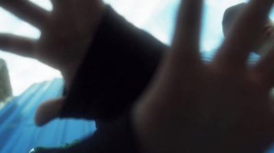 a blurry photo of a person holding a cell phone