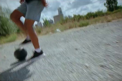 a person riding a skateboard down a street