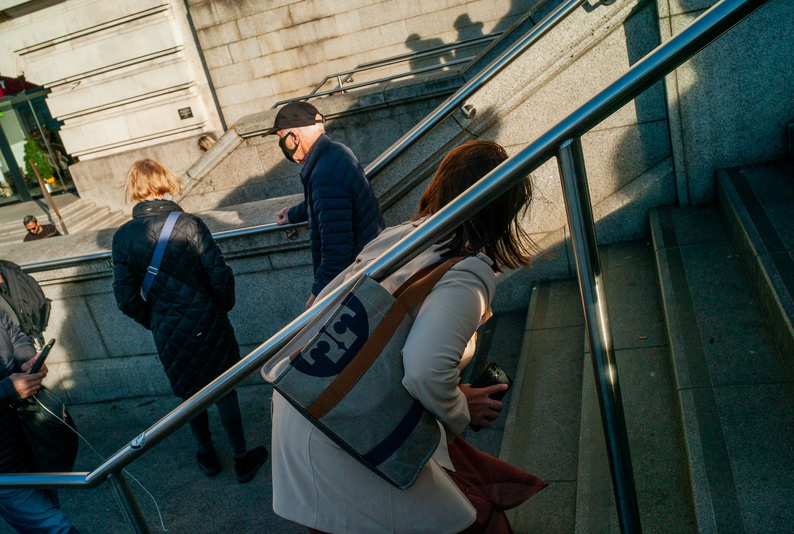 a group of people walking down a set of stairs