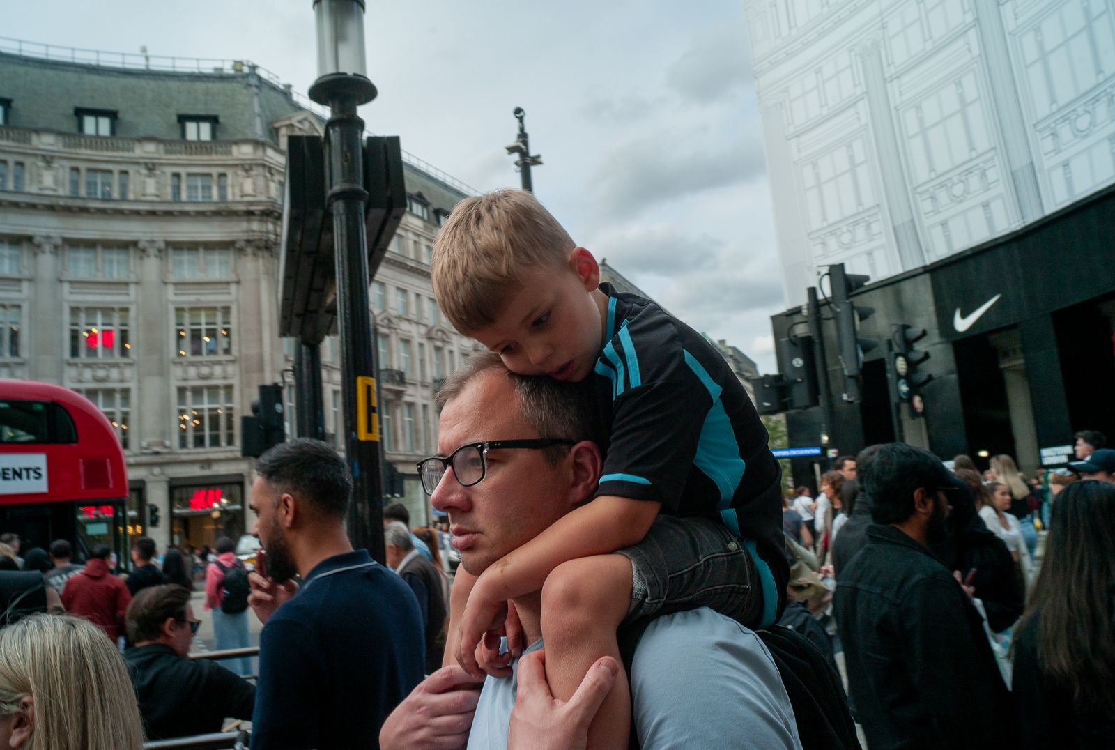 a man holding a young boy on his shoulders