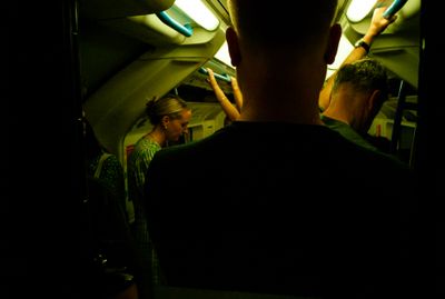 a group of people standing in a dark room