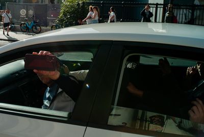 a man taking a picture of himself in a car