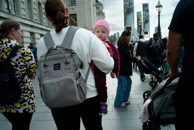 a group of people walking down a street