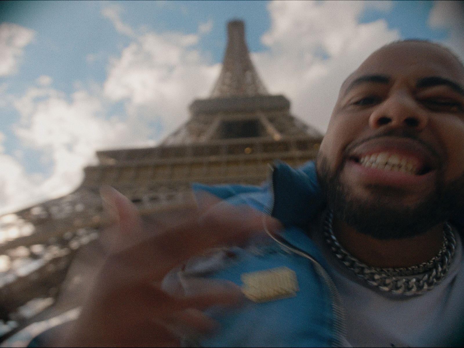 a man standing in front of the eiffel tower