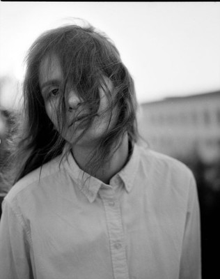 a black and white photo of a woman with long hair