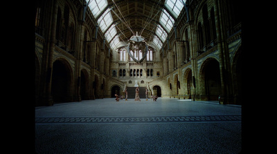 a large building with a clock hanging from the ceiling