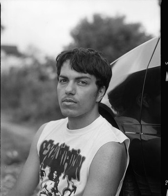 a black and white photo of a young man