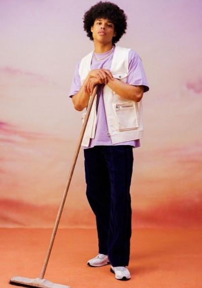 a man standing with a broom in his hand