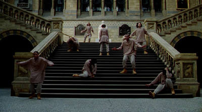 a group of men standing on top of a set of stairs