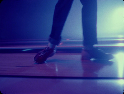 a person standing on top of a wooden floor