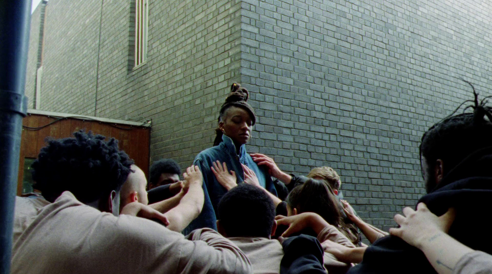 a group of people standing around each other