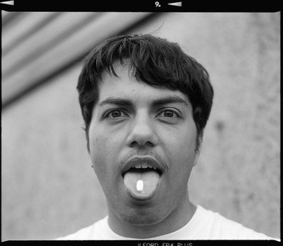 a black and white photo of a man making a funny face