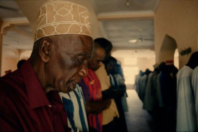 a group of people standing in a hallway