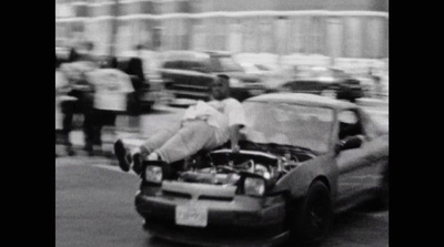 a car with its hood open on a city street