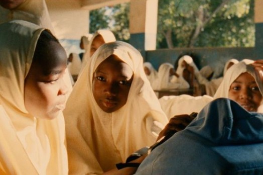 a group of young women sitting next to each other