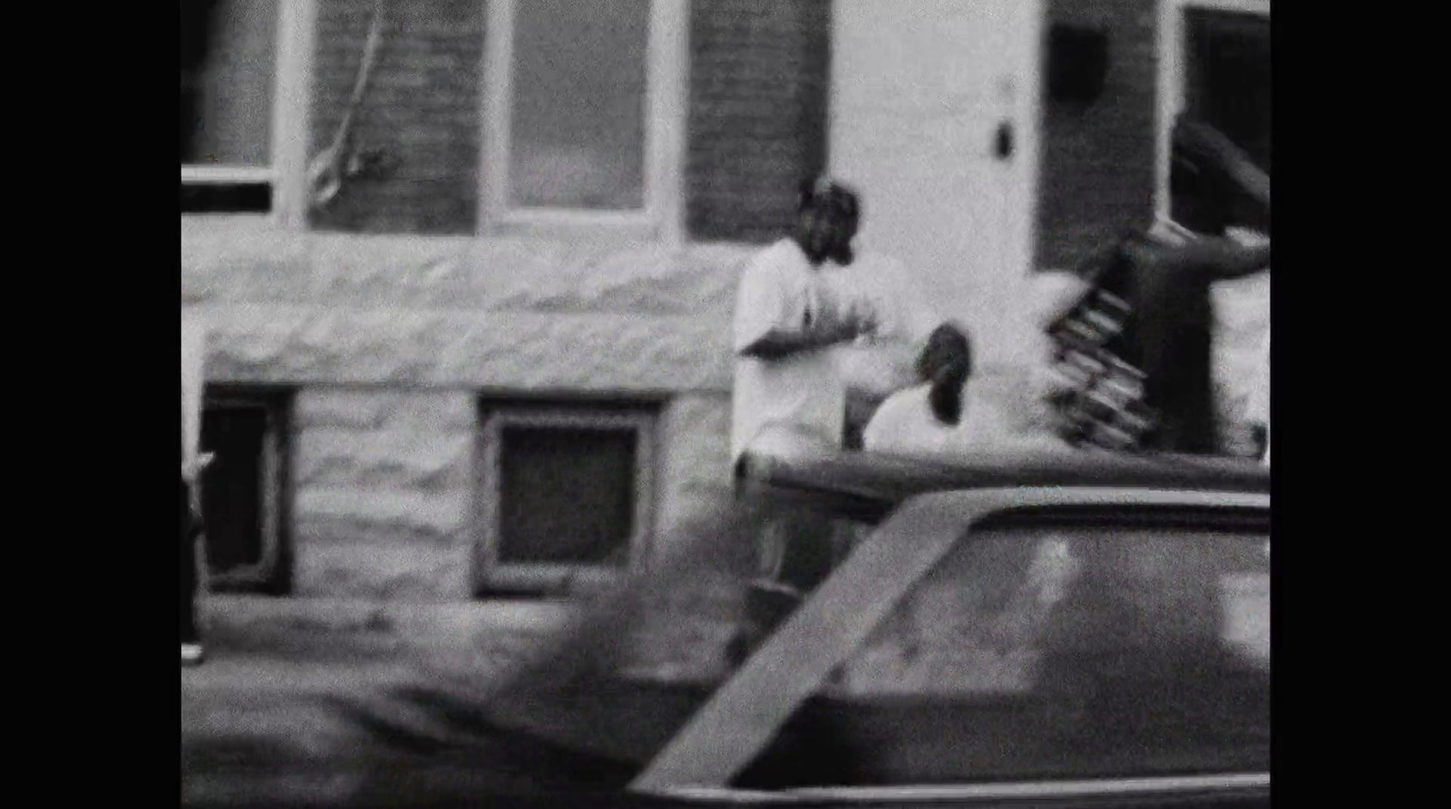 a black and white photo of a person on a skateboard