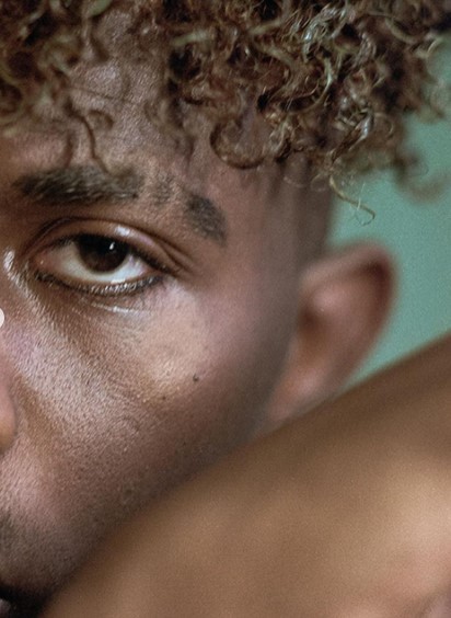 a close up of a person brushing his teeth