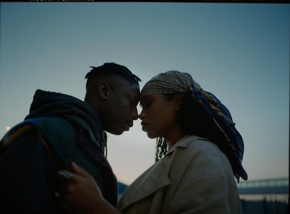 a man and a woman standing next to each other