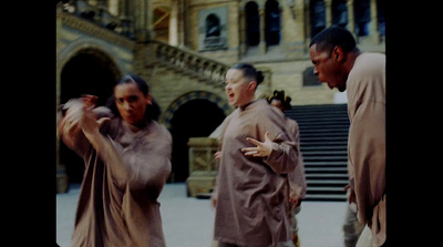 a group of people standing in front of a building