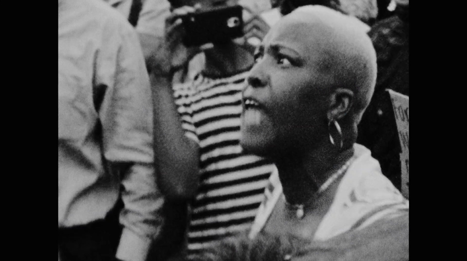 a black and white photo of a woman with a bald head