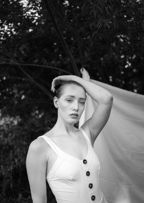 a black and white photo of a woman in a bathing suit